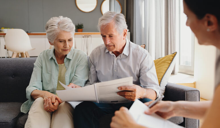 Older couple meeting with estate planning attorney