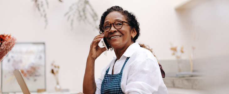 Elderly woman speaking on the phone