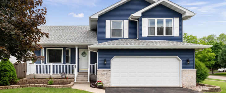 Exterior of a suburban home with blue siding