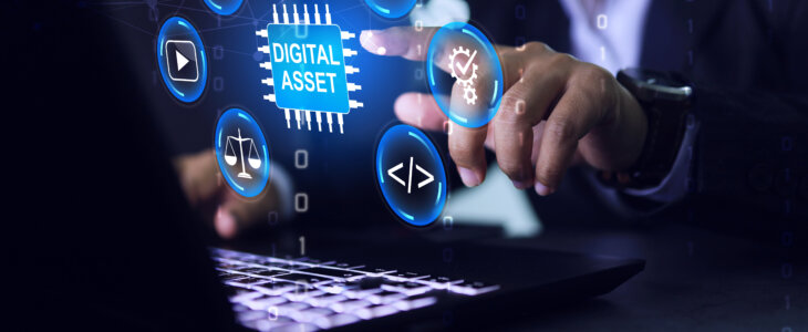 Digital asset management concept with businessman pointing on laptop screen