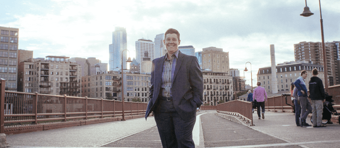 Chris Tymchuck with Minneapolis skyline in the background