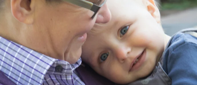 Chris holding her infant son