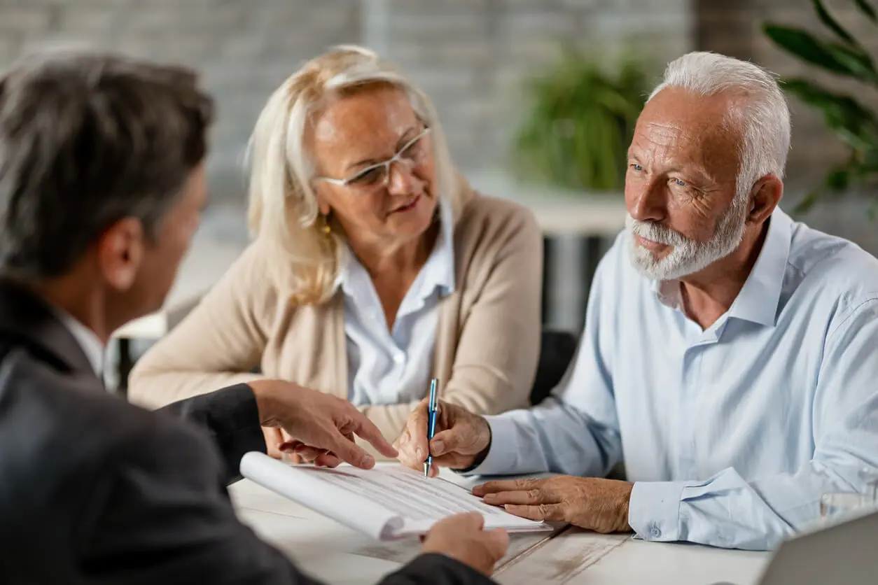 Elderly couple going over estate plan with attorney
