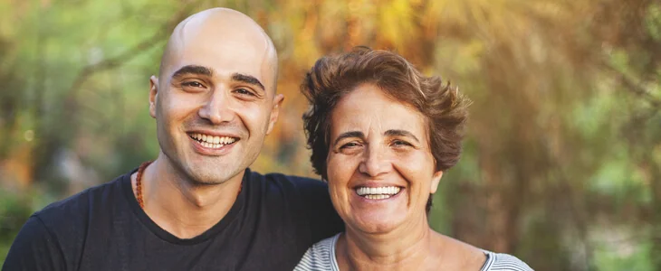 photo of a mother and son, both smiling